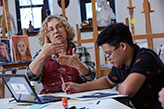 An art teacher talking to her class. Links to Gifts That Protect Your Assets An art teacher talking to her class. Links to Gifts That Protect Your Assets