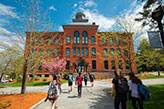 Students walking to a building. Links to Gifts of Real Estate