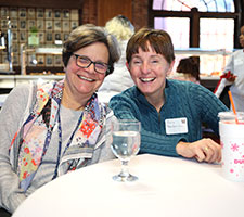 Women smiling at an event. Link to Life Stage Gift Planner Ages 45-65 Situations.